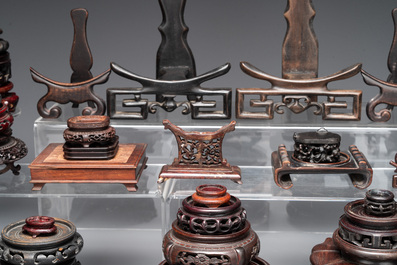 A collection of 55 Chinese wooden stands, 19/20th C.