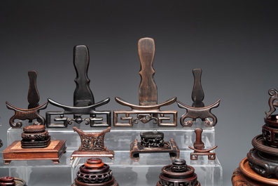 A collection of 55 Chinese wooden stands, 19/20th C.