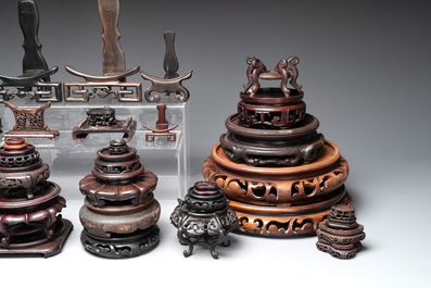 A collection of 55 Chinese wooden stands, 19/20th C.