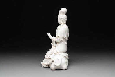 A Chinese Dehua blanc de Chine Guanyin seated on a lion, 20th C.