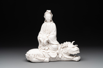 A Chinese Dehua blanc de Chine Guanyin seated on a Buddhist lion, 20th C.