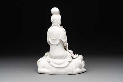 A Chinese Dehua blanc de Chine Guanyin seated on a lion, 20th C.