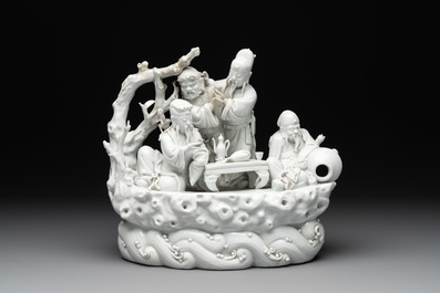 A Chinese Dehua blanc de Chine group of four deities on a boat, Republic