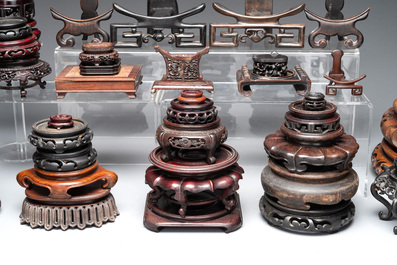A collection of 55 Chinese wooden stands, 19/20th C.