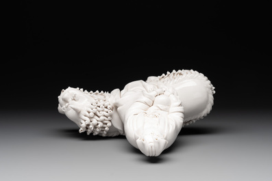 A Chinese Dehua blanc de Chine Guanyin seated on a Buddhist lion, 20th C.
