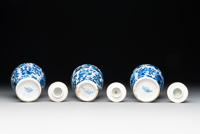 A Chinese blue and white garniture with five vases, Kangxi