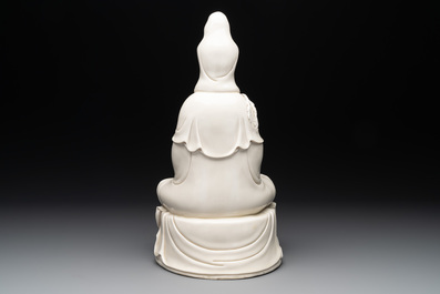 A Chinese Dehua blanc de Chine Guanyin seated on a lotus throne, 20th C.