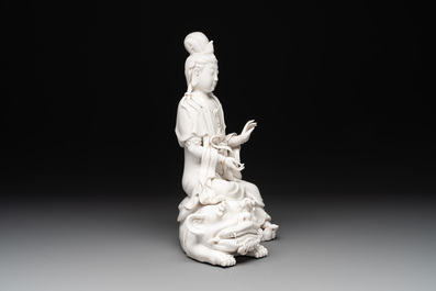 A Chinese Dehua blanc de Chine Guanyin seated on a lion, 20th C.