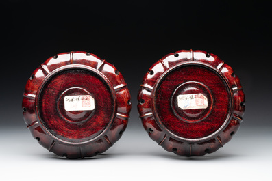 Two Chinese eggshell famille rose 'dragon' bowls on wooden stands, Qianlong mark, 20th C.