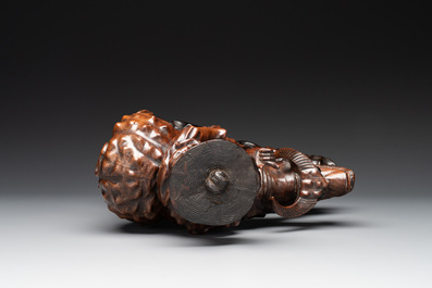 A Chinese carved wooden group of a boy riding a water buffalo, 20th C.