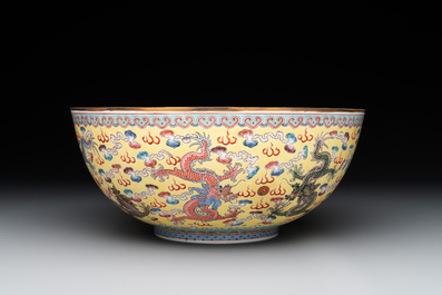 Two Chinese eggshell famille rose 'dragon' bowls on wooden stands, Qianlong mark, 20th C.