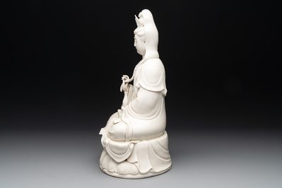 A Chinese Dehua blanc de Chine Guanyin seated on a lotus throne, 20th C.