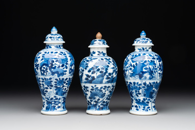 A Chinese blue and white garniture with five vases, Kangxi