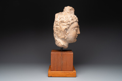 A large terracotta head of Buddha Shayamuni, Gandhara region, Kushan period, 4/5th C.