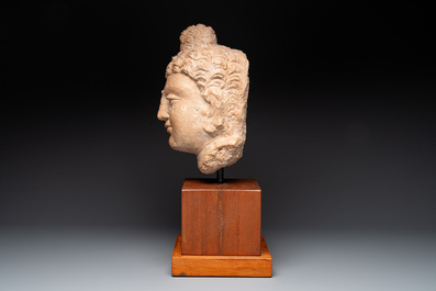 A large terracotta head of Buddha Shayamuni, Gandhara region, Kushan period, 4/5th C.