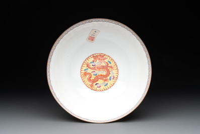 Two Chinese eggshell famille rose 'dragon' bowls on wooden stands, Qianlong mark, 20th C.
