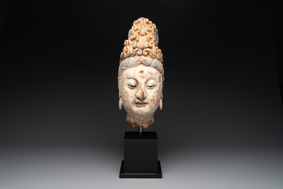 A large Chinese polychromed wooden head of Guanyin, probably Ming