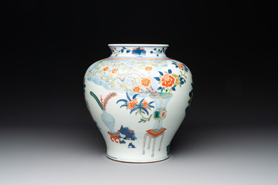 A Chinese wucai vase and seven blue and white jarlets, 19th C.
