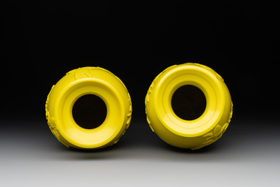 A pair of Chinese yellow Peking glass vases with peonies and a bird, 20th C.