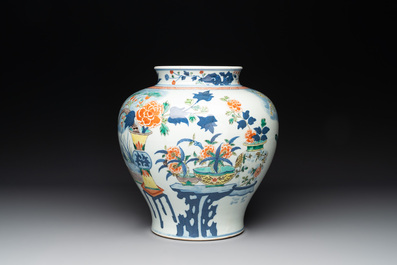 A Chinese wucai vase and seven blue and white jarlets, 19th C.