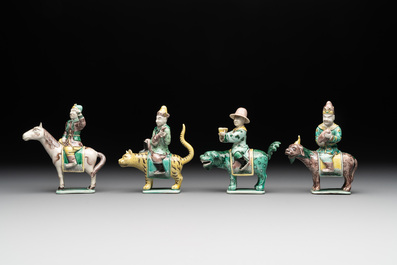 Eight Chinese verte biscuit figures riding mythical animals, 19/20th C.