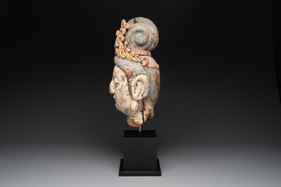 A large Chinese polychromed wooden head of Guanyin, probably Ming