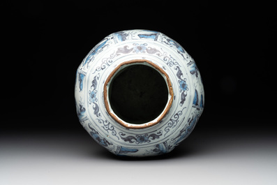 A blue and white Dutch Delft 'chinoiserie' tulip vase, a baluster vase and a pewter-mounted jug, 17th C.