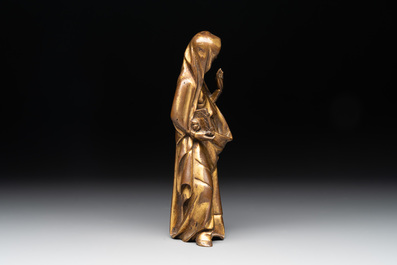 A gilt bronze figure of the Virgin of the Annunciation, probably 15th C.