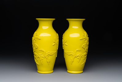 A pair of Chinese yellow Peking glass vases with peonies and a bird, 20th C.