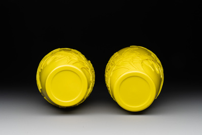 A pair of Chinese yellow Peking glass vases with peonies and a bird, 20th C.