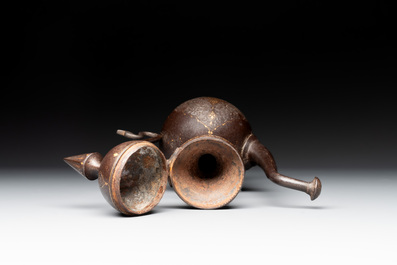A Persian steel engraved gilt-decorated pear-shaped ewer and cover with floral design, Qajar, 19th C.