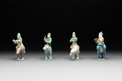 Eight Chinese verte biscuit figures riding mythical animals, 19/20th C.