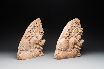 A pair of Cambodian terracotta architectural ornaments depicting Kala, late Khmer period