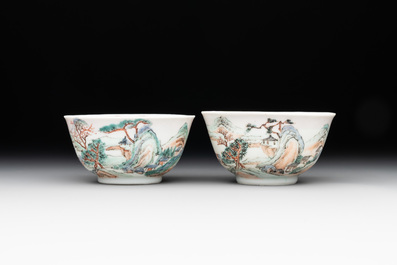 Two Chinese famille rose cups and three saucers with a fine landscape design, Yongzheng/Qianlong