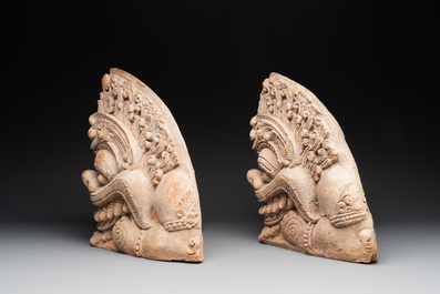 A pair of Cambodian terracotta architectural ornaments depicting Kala, late Khmer period