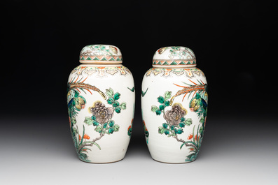 A pair of Chinese famille verte 'pheasant among flowering branches' vases and covers, 19th C.