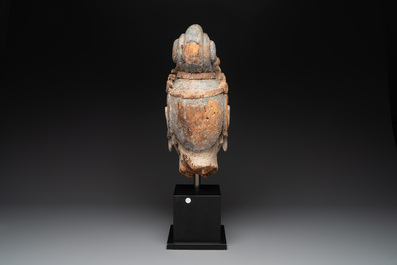 A large Chinese polychromed wooden head of Guanyin, probably Ming
