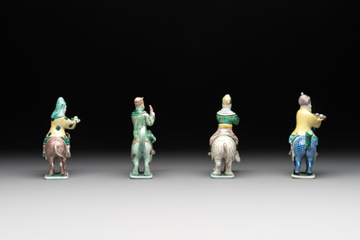 Eight Chinese verte biscuit figures riding mythical animals, 19/20th C.