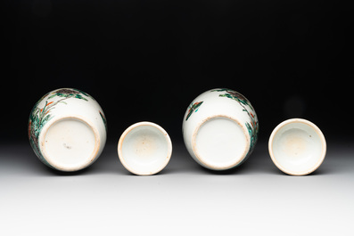 A pair of Chinese famille verte 'pheasant among flowering branches' vases and covers, 19th C.