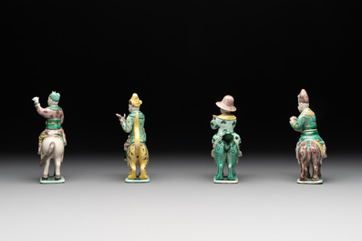 Eight Chinese verte biscuit figures riding mythical animals, 19/20th C.