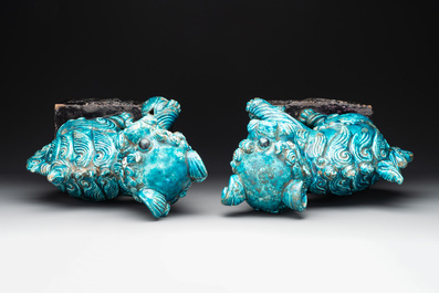 A pair of Chinese turquoise-and-aubergine-glazed Buddhist lions on stands, probably Swatow kilns, 19th C.