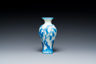 A Chinese blue-overlay white Beijing glass 'meiping' vase, a bowl and a bottle, 19/20th C.