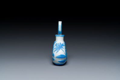 A Chinese blue-overlay white Beijing glass 'meiping' vase, a bowl and a bottle, 19/20th C.