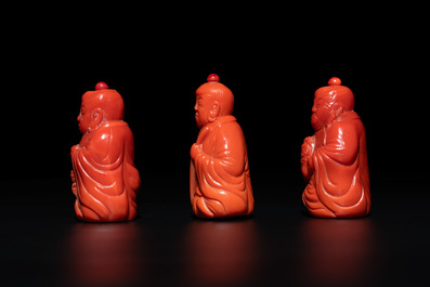 A set of ten Chinese coral-red glass Luohan-form snuff bottles, 20th C.