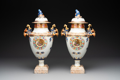 A pair of Chinese export famille rose urns and covers, Qianlong