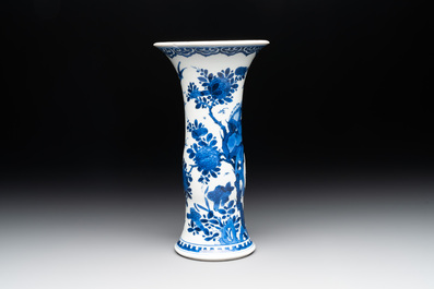 A Chinese blue and white 'gu' vase with birds amongst flowering branches, Kangxi