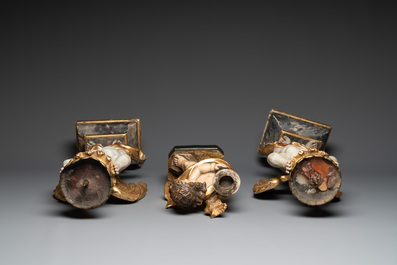 Three gilt and polychromed wooden angel-form candlesticks, Germany, 18th C.