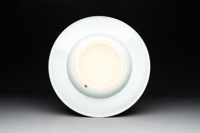 A large Chinese blue and white armorial dish with the arms of the Coelho family, Kangxi