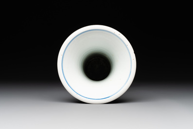 A Chinese blue and white 'gu' vase with birds amongst flowering branches, Kangxi