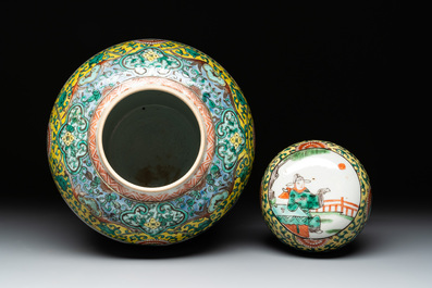 A pair of Chinese famille verte yellow-ground vases and covers with narrative design, 19th C.